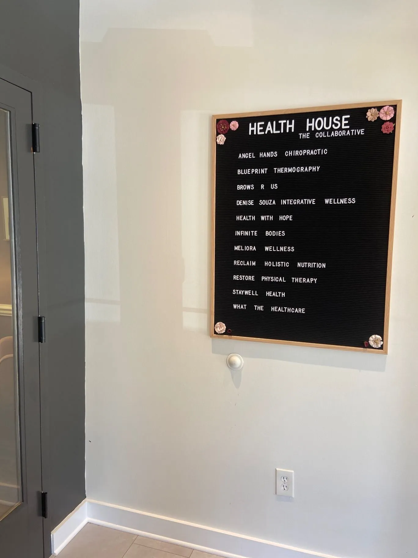 Health House Collaborative letter board in a Raleigh studio hallway.